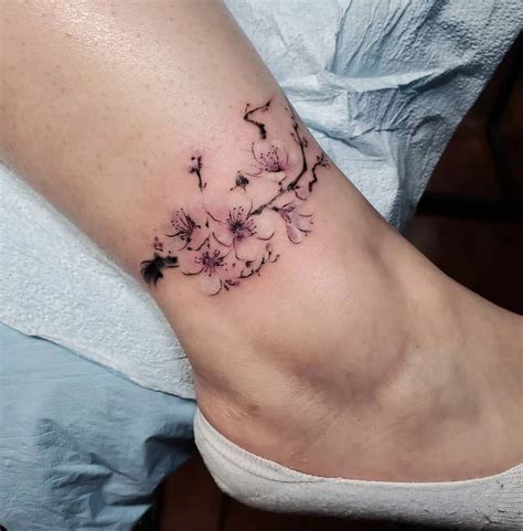 flower tattoo on foot|small flower tattoo designs.